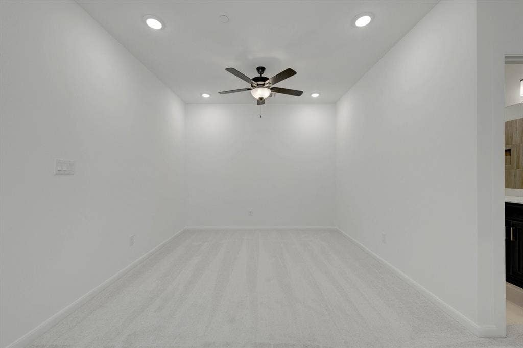 2852 Yampa Drive, McKinney, TX 75071 Carpeted room featuring a ceiling fan with integrated lighting and recessed lighting fixtures