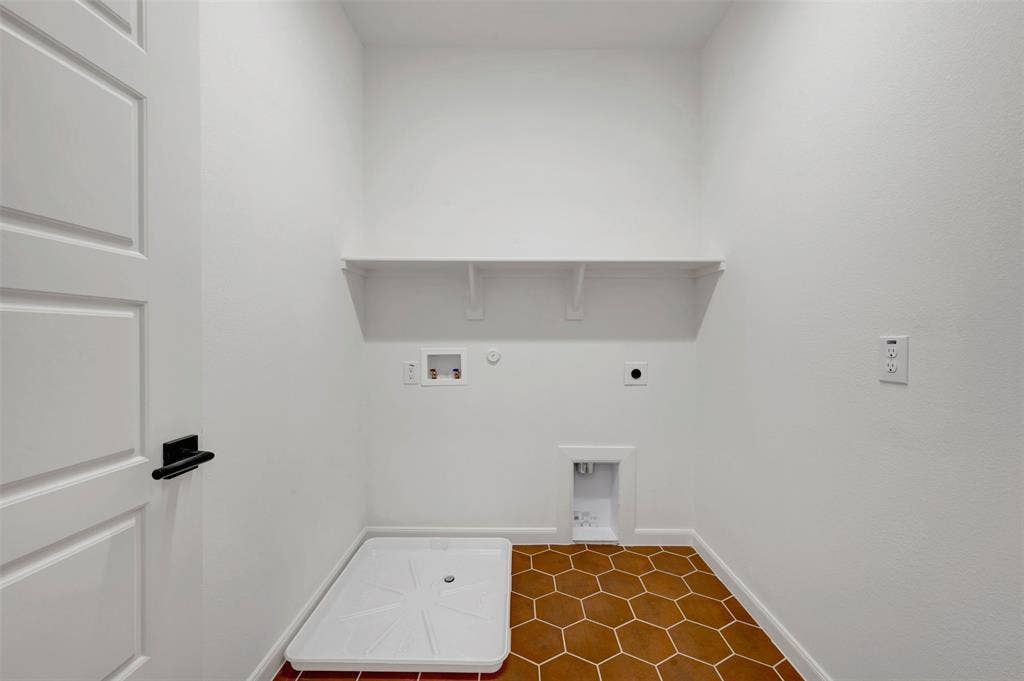 2860 Yampa Drive, McKinney, TX 75071 Laundry area featuring hexagon floor tiling, a white built-in shelf, and a utility tray