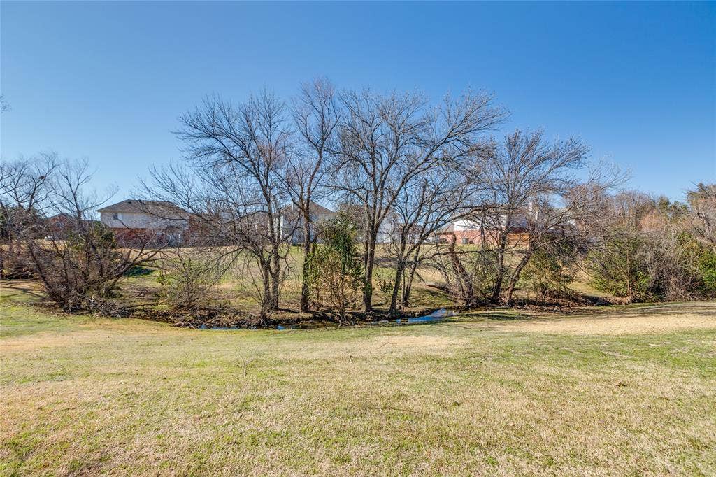 6841 Douglas Creek, Plano, TX 75023 Huge greenbelt with creek directly behind home with access from backyard gate!