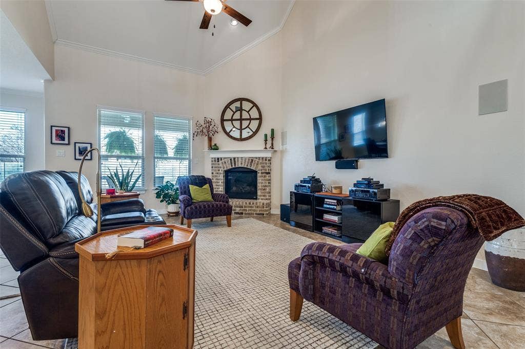 Living Room is part of a great room with wonderful windows to the back porch and a nice fireplace. Perfect for get-togethers.