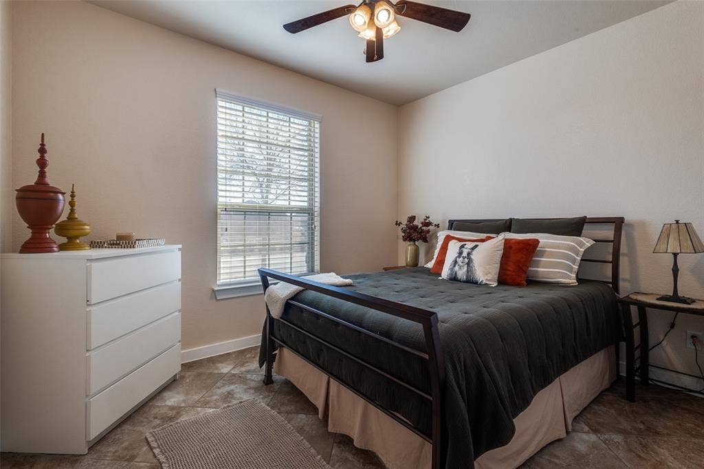 This secondary bedroom on the main floor at the front of the house could serve as a private office or bedroom. The secondary bathroom is next door.