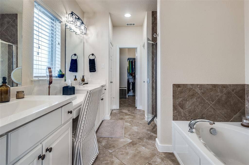 A generous walk in closet is convenient to the primary bath.