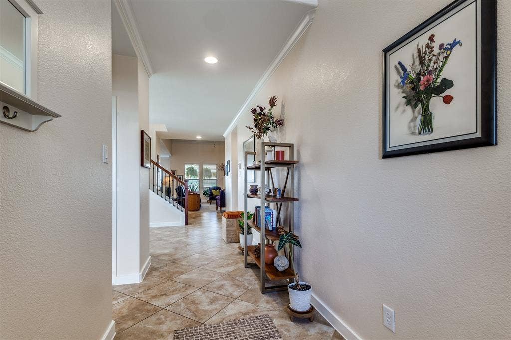 Guest bedroom and bath off to the left and dining room opens off the entry just before the stairway.