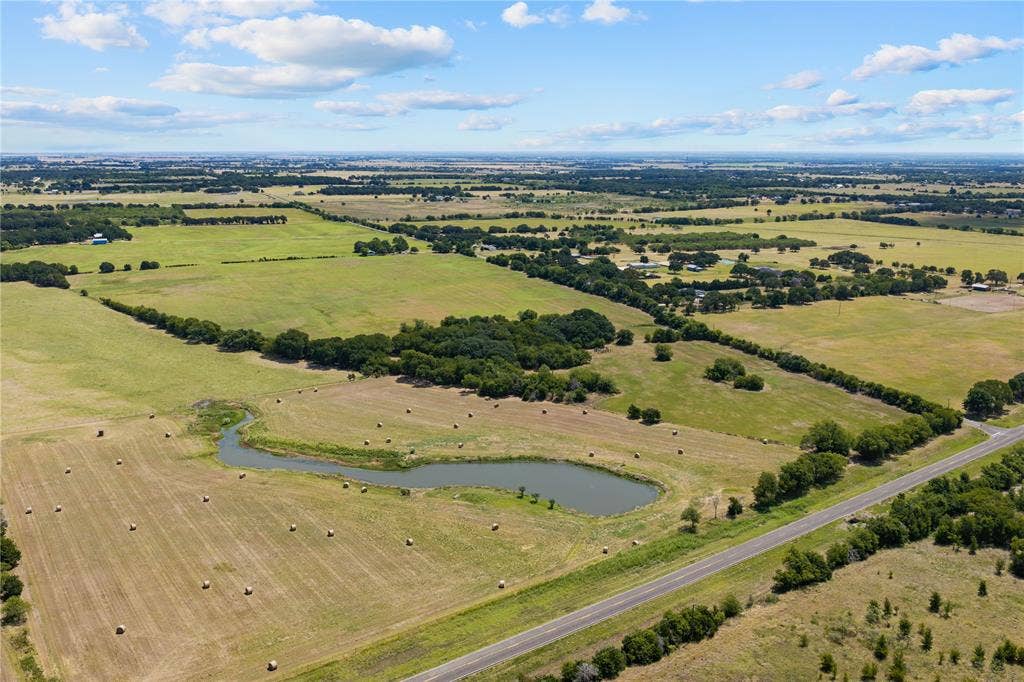 Expansive open land featuring diverse terrain and natural water features