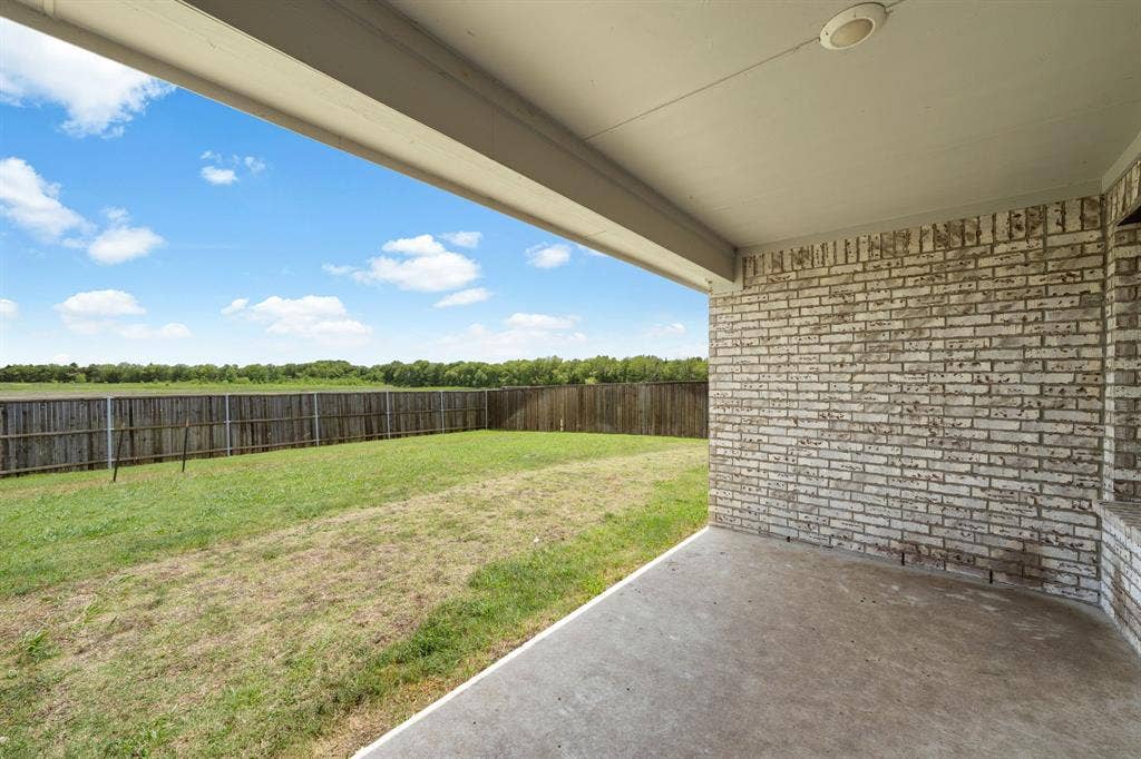 653 Bunker Hill Road, Fate, TX 75189 Covered patio with concrete flooring, white brick exterior wall, and recessed ceiling lighting