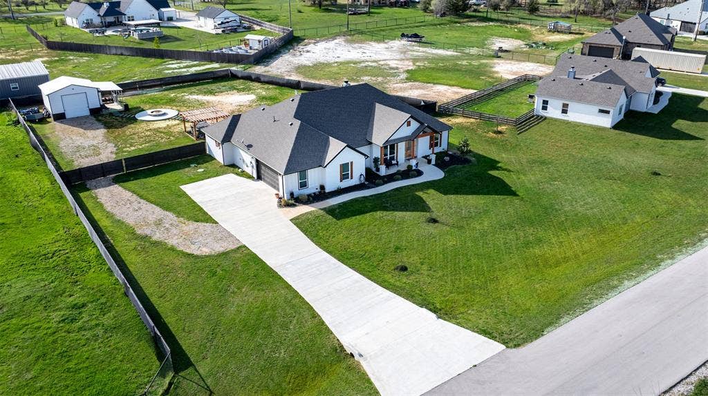 111 Bluegrass Trail, Springtown, TX 76082 Nestled on a 1/02 acre lot with spacious backyard.