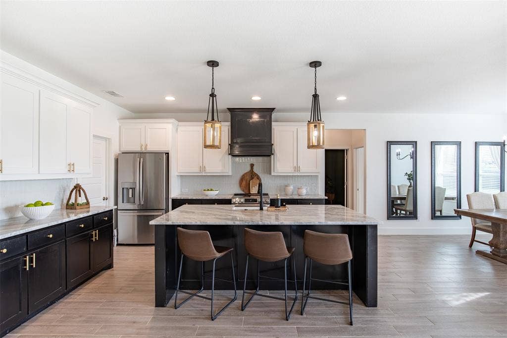 111 Bluegrass Trail, Springtown, TX 76082 Chef's kitchen features wood cabinetry with luxury hardware.