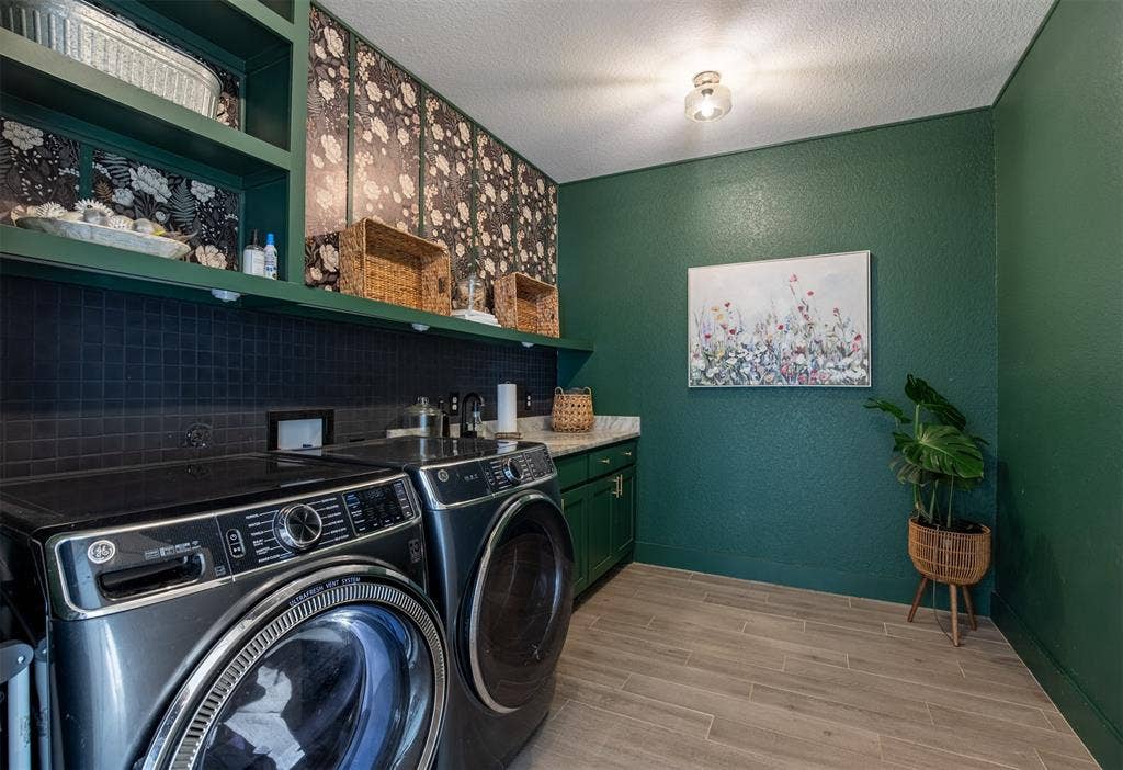 111 Bluegrass Trail, Springtown, TX 76082 Oversized laundry room with sink, built-in cabinetry, and shelving.