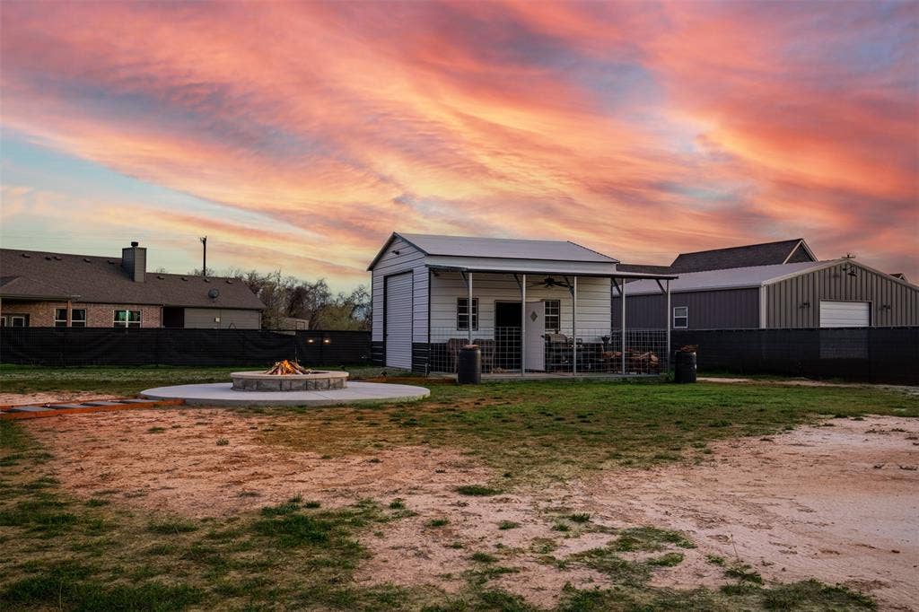 111 Bluegrass Trail, Springtown, TX 76082 Backyard boasts 20x20 shop with 10x20 extension.