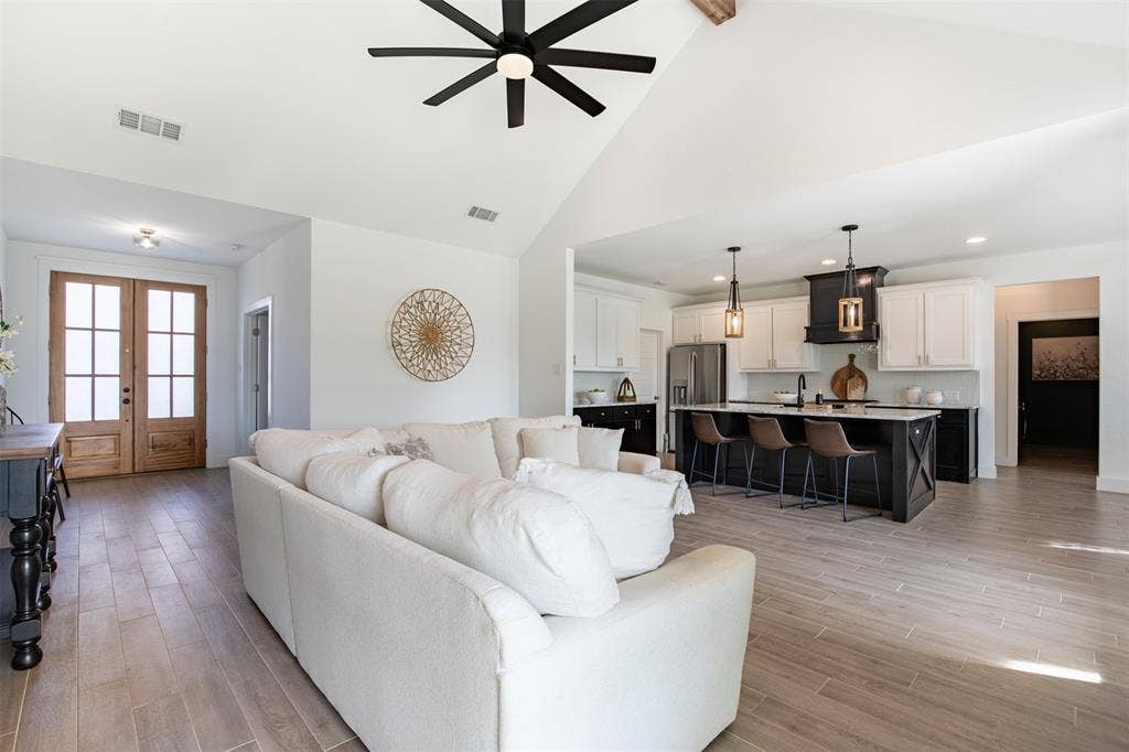 111 Bluegrass Trail, Springtown, TX 76082 Living room flows seamlessly to kitchen and dining areas.