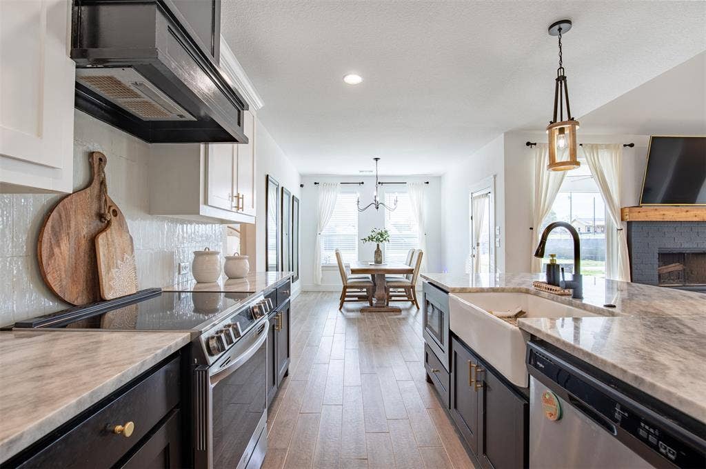 111 Bluegrass Trail, Springtown, TX 76082 Kitchen boasts stainless steel appliances and farm sink.