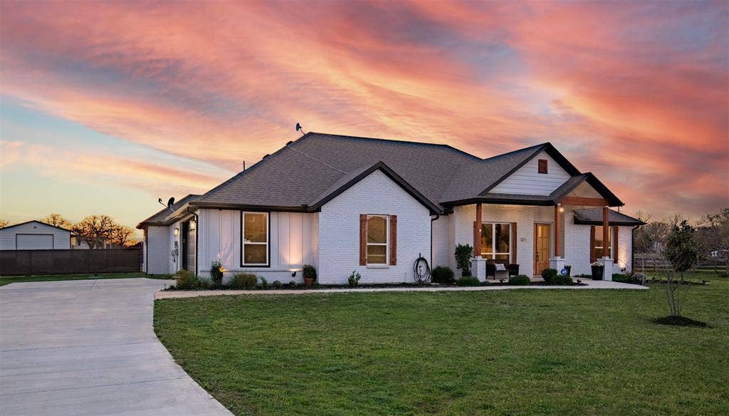 111 Bluegrass Trail, Springtown, TX 76082 Nestled nicely on over a 1 acre lot with side entry garage and generous driveway.