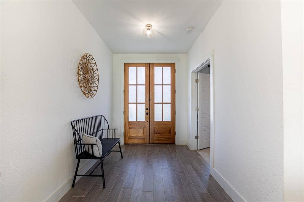 111 Bluegrass Trail, Springtown, TX 76082 Entry features double glass door entry with privacy glass and double door entry to dedicated office.