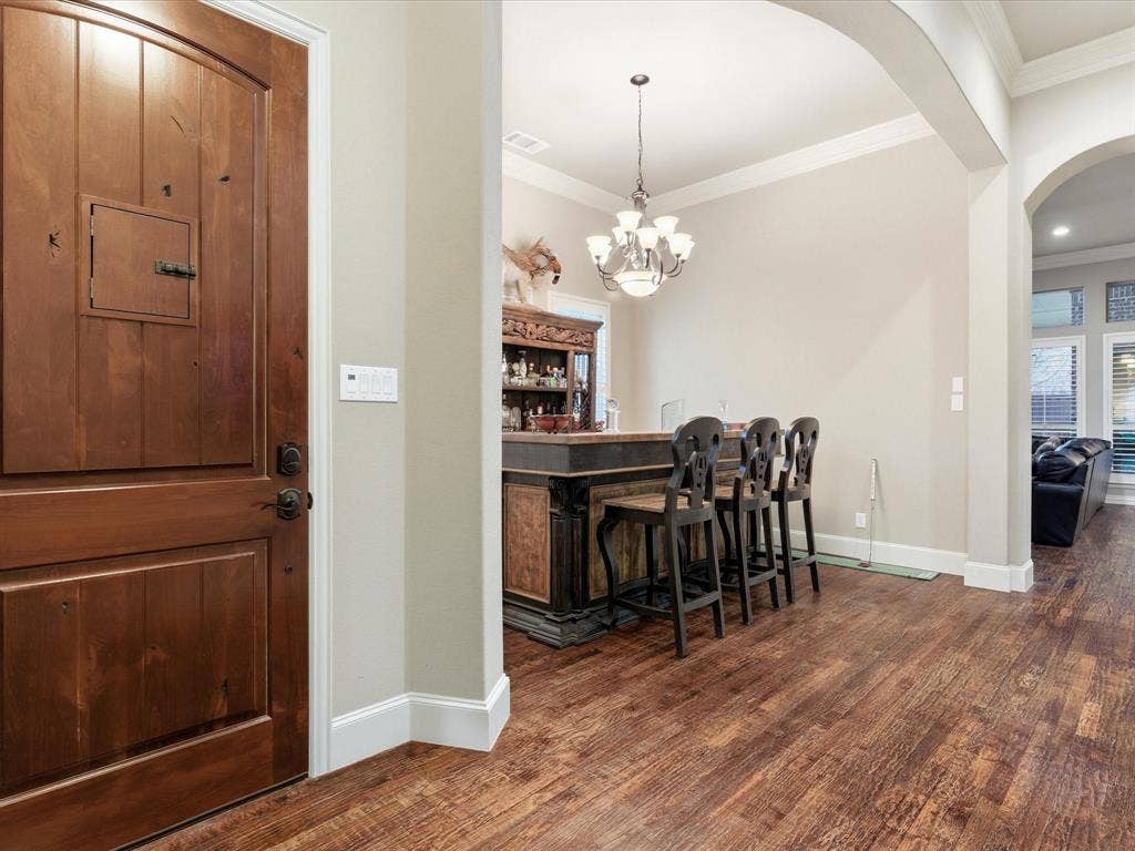2115 N Hill Drive, Irving, TX 75038 Foyer with crown molding and hand scraped 3/4 inch oak flooring.