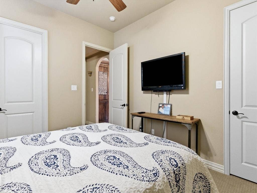 2115 N Hill Drive, Irving, TX 75038 Secondary bedroom with solid 8 foot doors and oil rubbed bronze hardware.
