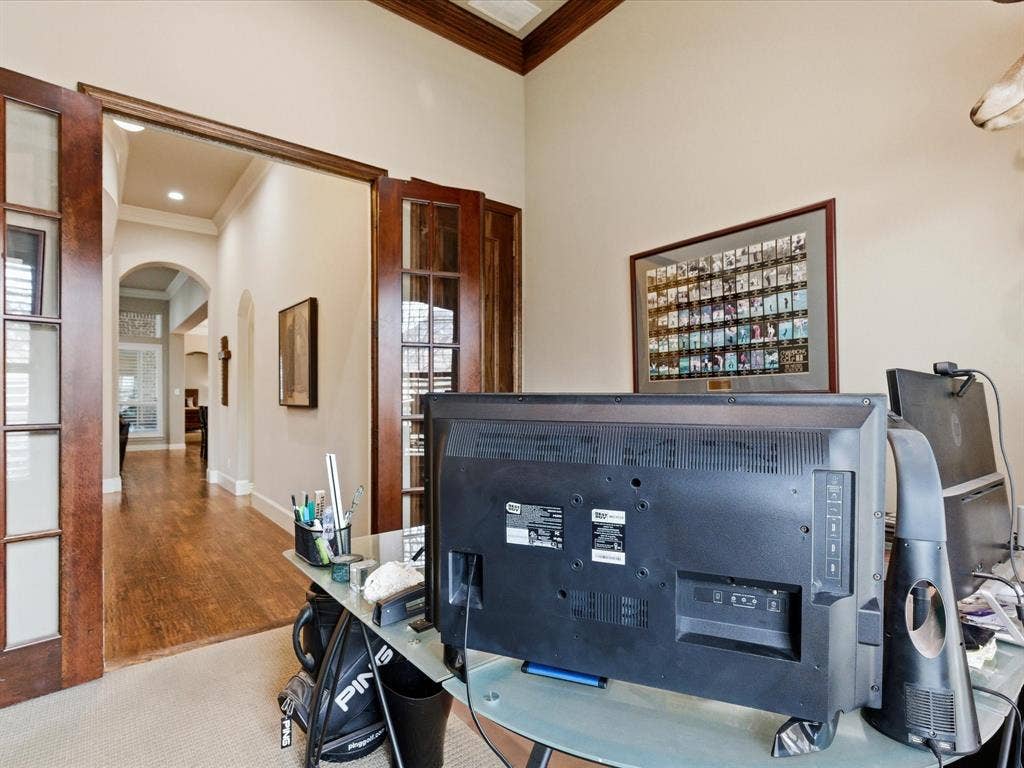 2115 N Hill Drive, Irving, TX 75038 Office area stained molding, carpet, closet and wood doors.