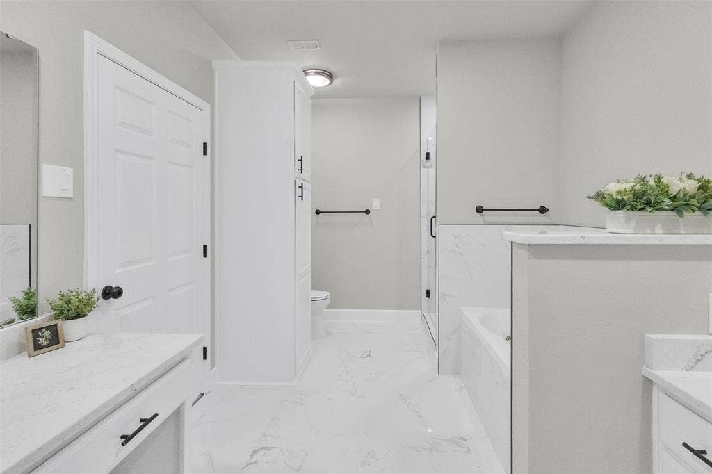3415 Fm 3211, Caddo Mills, TX 75135 Bathroom featuring vanity, a bath, and a marble finish shower