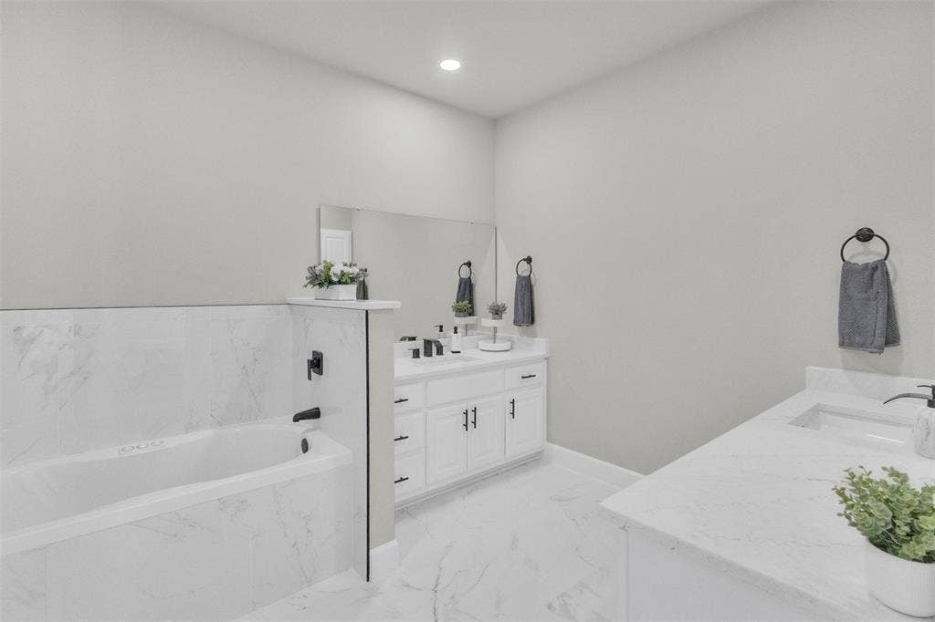3415 Fm 3211, Caddo Mills, TX 75135 Full bathroom featuring a garden tub, two vanities, recessed lighting, and light marble finish floors
