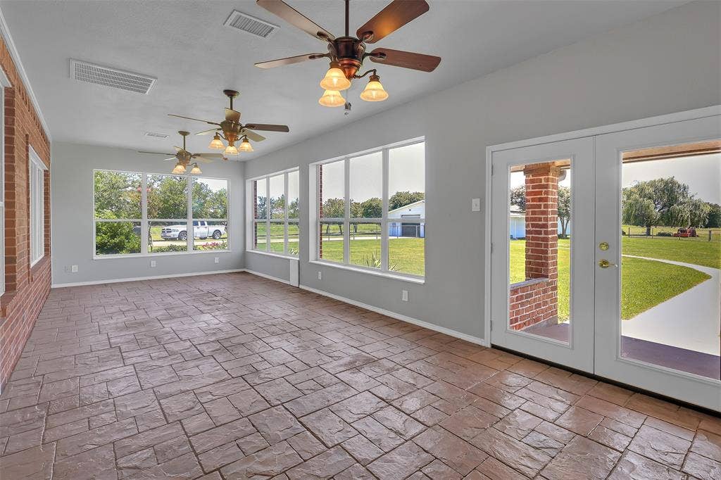 3415 Fm 3211, Caddo Mills, TX 75135 Unfurnished sunroom featuring french doors and ceiling fan