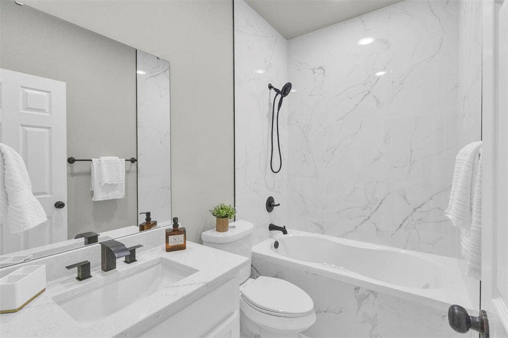 3415 Fm 3211, Caddo Mills, TX 75135 Full bathroom with vanity and a combined bath / shower with marble appearance