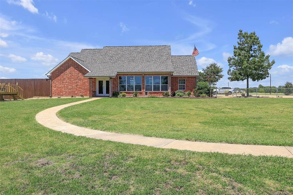 3415 Fm 3211, Caddo Mills, TX 75135 Rear view of house featuring brick siding, french doors, and a shingled roof