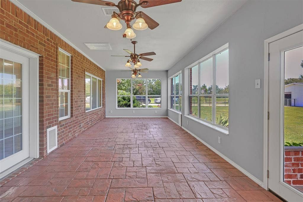 3415 Fm 3211, Caddo Mills, TX 75135 Unfurnished sunroom with ceiling fan