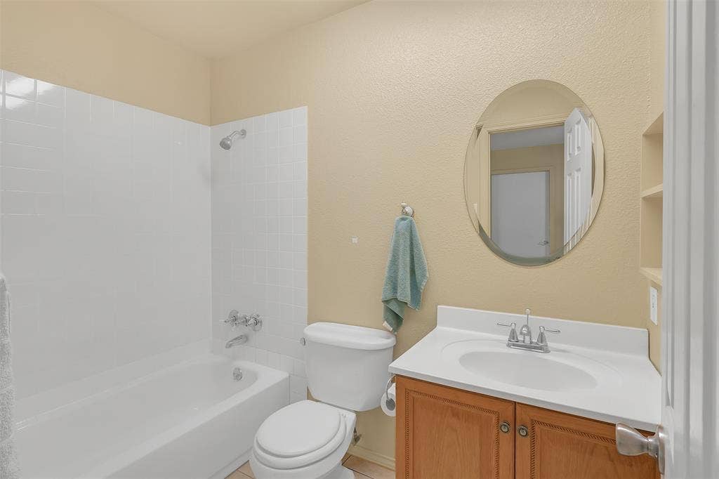 3415 Fm 3211, Caddo Mills, TX 75135 Bathroom with vanity, shower / washtub combination, and a textured wall
