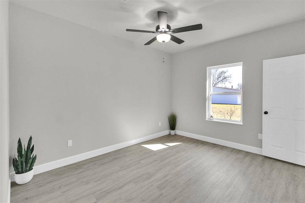 3415 Fm 3211, Caddo Mills, TX 75135 Unfurnished room with light wood-type flooring and a ceiling fan