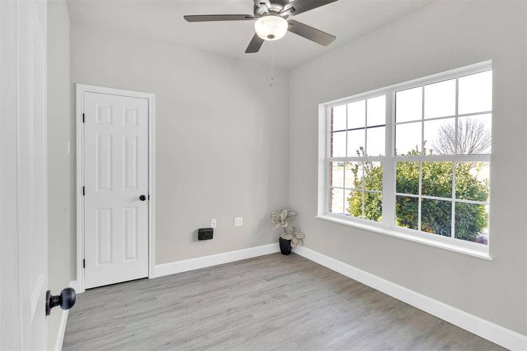 3415 Fm 3211, Caddo Mills, TX 75135 Spare room featuring ceiling fan and light wood-type flooring