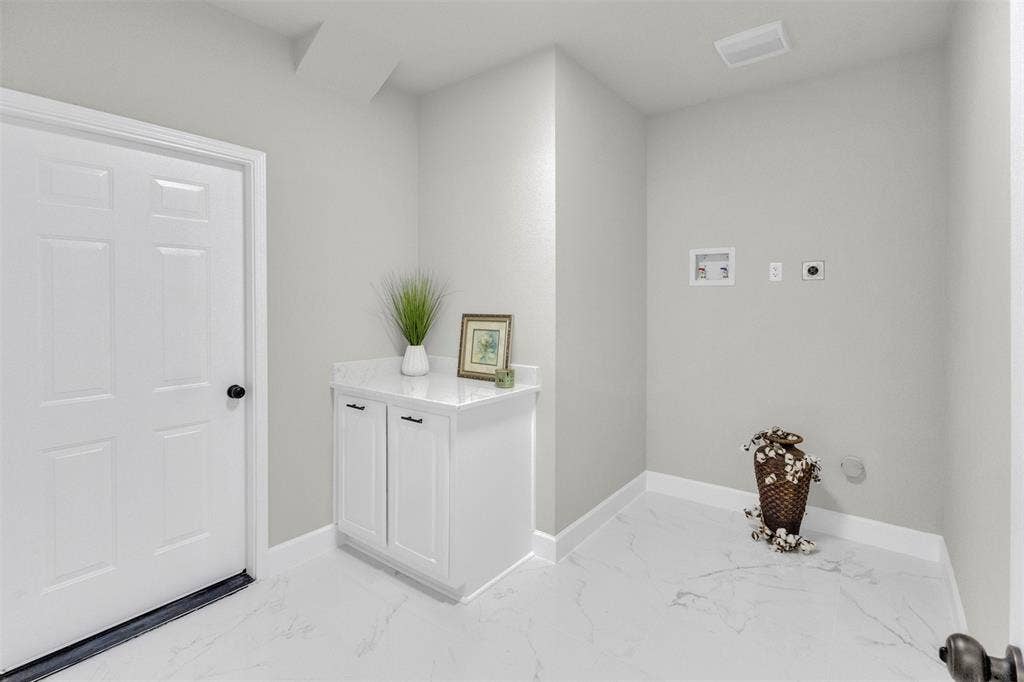 3415 Fm 3211, Caddo Mills, TX 75135 Laundry area featuring light marble finish flooring, washer hookup, and hookup for an electric dryer
