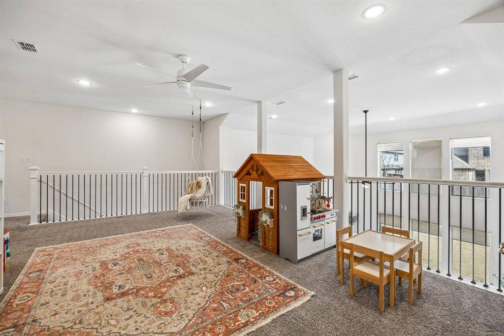 13674 Carmenita Drive, Frisco, TX 75035 Rec room with dark colored carpet, a ceiling fan, and recessed lighting