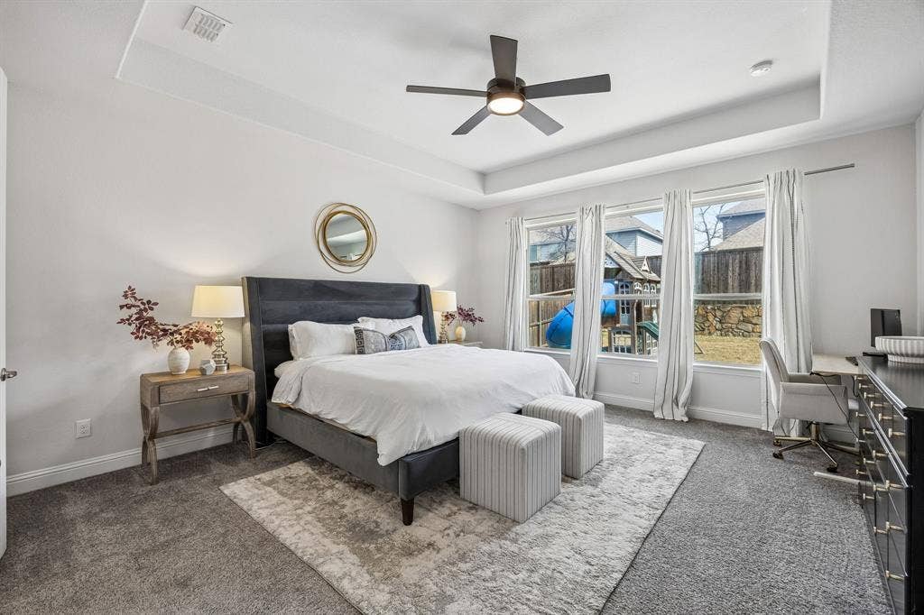 13674 Carmenita Drive, Frisco, TX 75035 Bedroom with carpet flooring, a raised ceiling, a desk, and ceiling fan