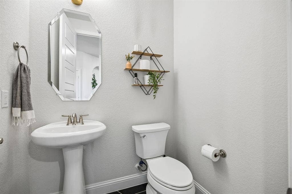 13674 Carmenita Drive, Frisco, TX 75035 Bathroom featuring toilet and a textured wall