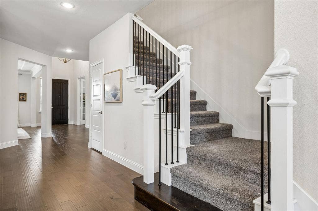 13674 Carmenita Drive, Frisco, TX 75035 Stairway with hardwood / wood-style flooring and recessed lighting