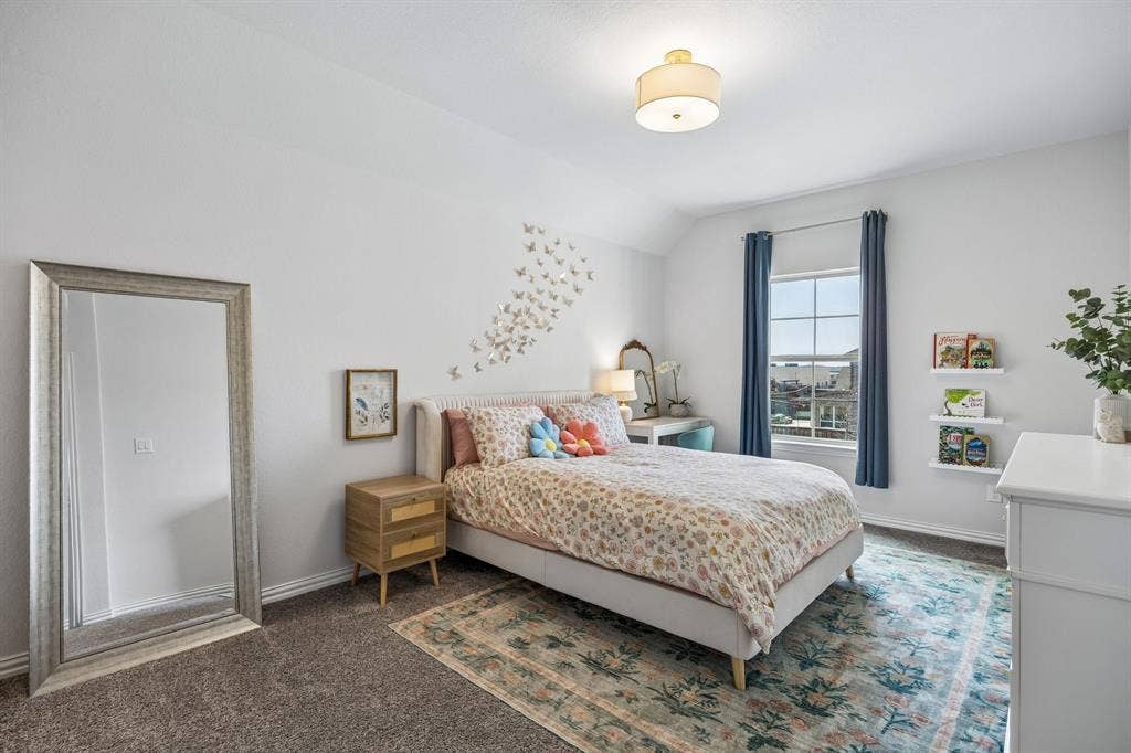 13674 Carmenita Drive, Frisco, TX 75035 Bedroom with dark carpet and vaulted ceiling