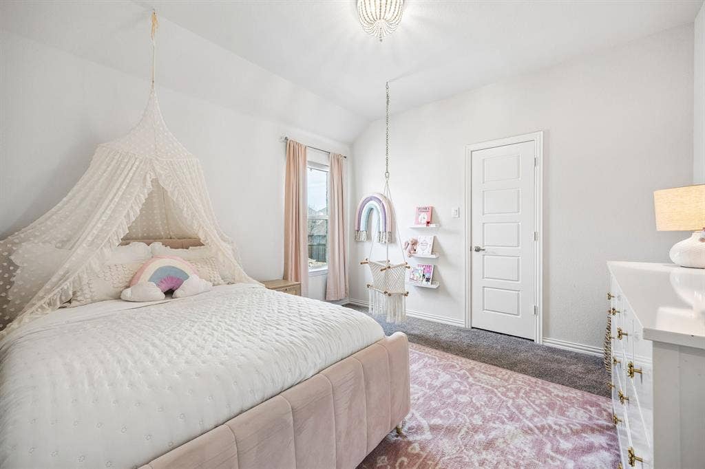 13674 Carmenita Drive, Frisco, TX 75035 Carpeted bedroom featuring baseboards and lofted ceiling