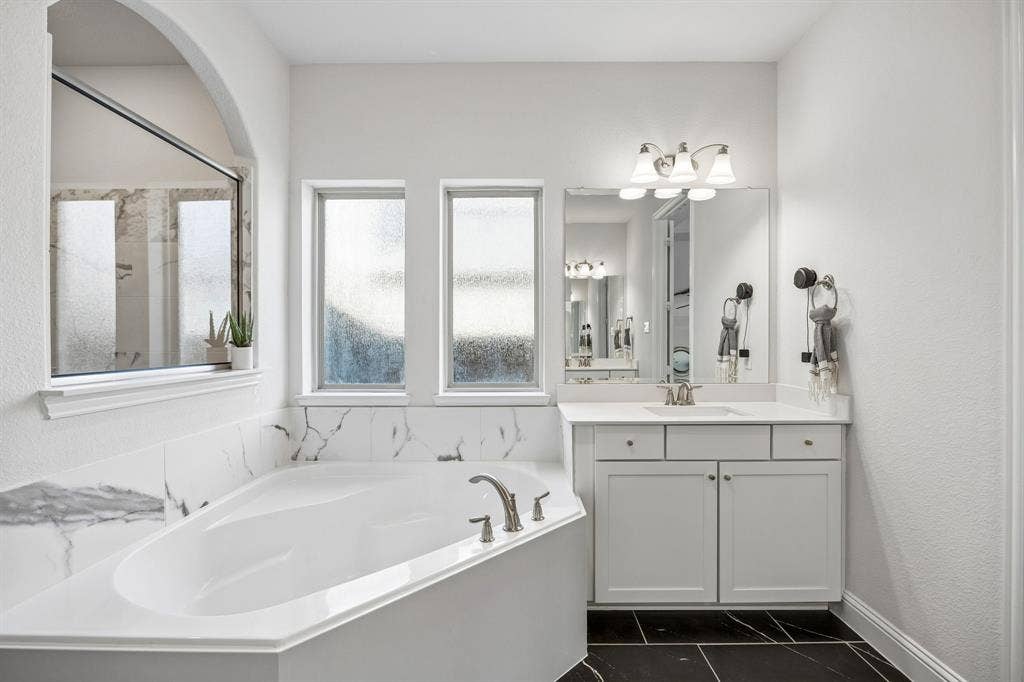 13674 Carmenita Drive, Frisco, TX 75035 Bathroom with a bath and vanity