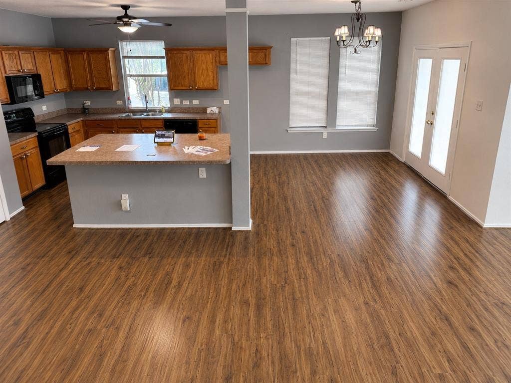 103 Denali Court, Terrell, TX 75160 Open-concept living space featuring wood-finish flooring throughout