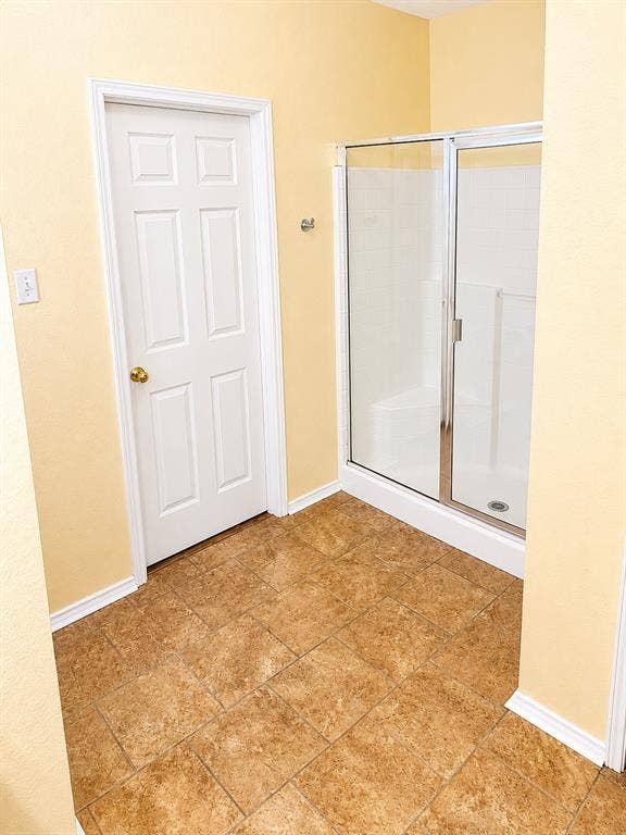 103 Denali Court, Terrell, TX 75160 Walk-in shower with clear glass enclosure and white base