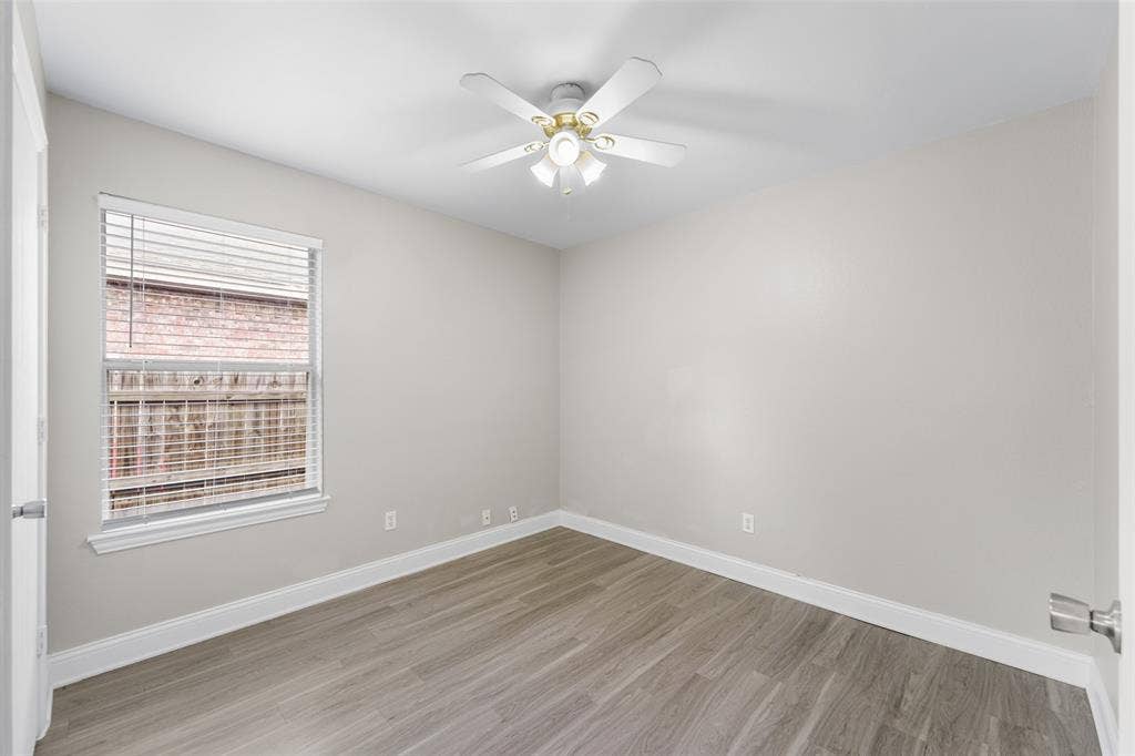 2408 Castle Ridge Drive, McKinney, TX 75071 Spare room with light wood finished floors and ceiling fan