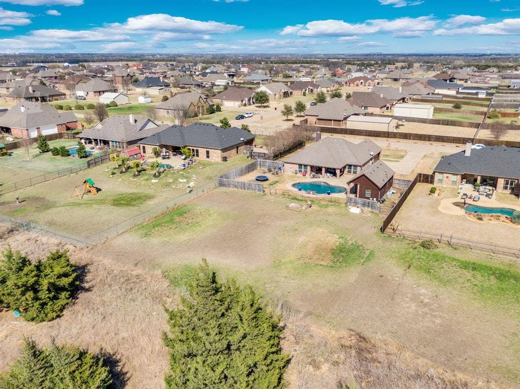 160 Berkshire Lane, Waxahachie, TX 75165 Aerial perspective of suburban area featuring a pool area
