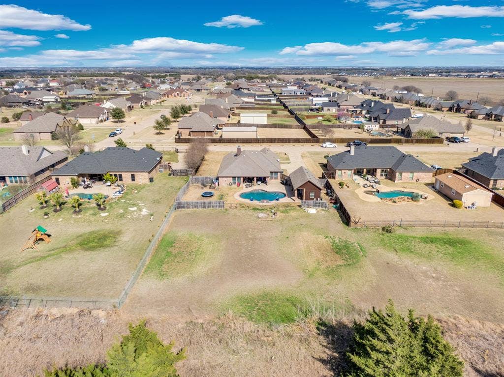 160 Berkshire Lane, Waxahachie, TX 75165 Aerial view of residential area featuring a pool area