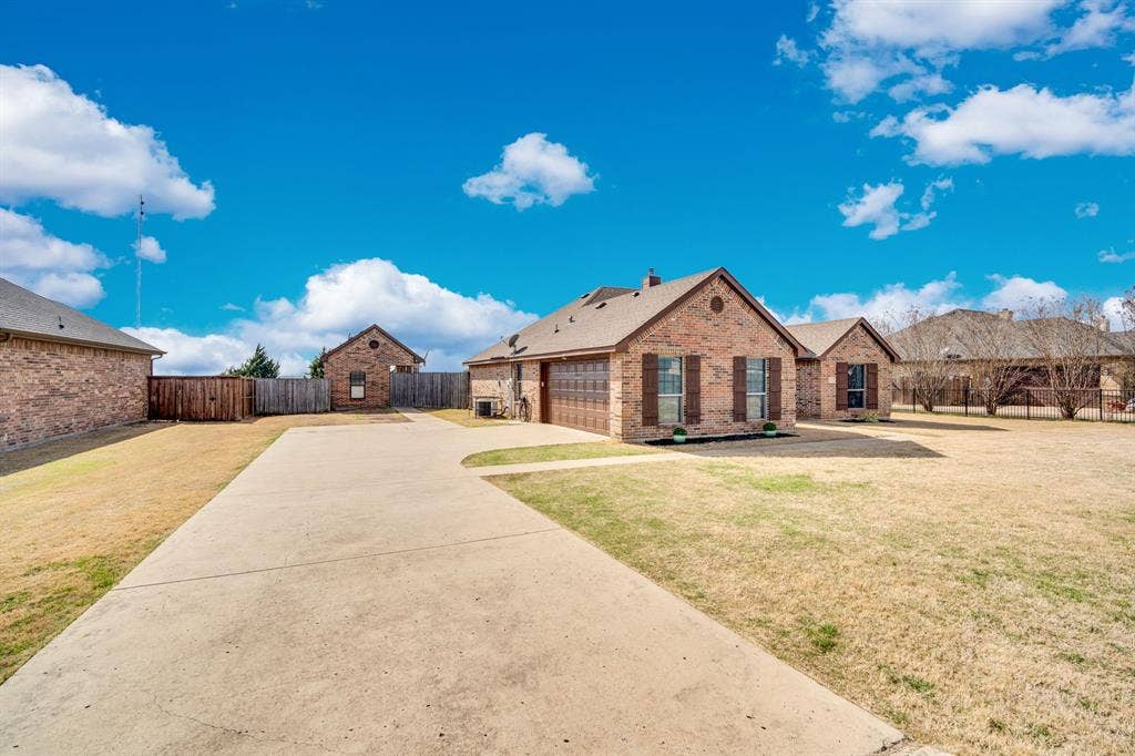 160 Berkshire Lane, Waxahachie, TX 75165 Bathroom with a stall shower, a whirlpool tub, recessed lighting, lofted ceiling, and dark tile patterned flooring