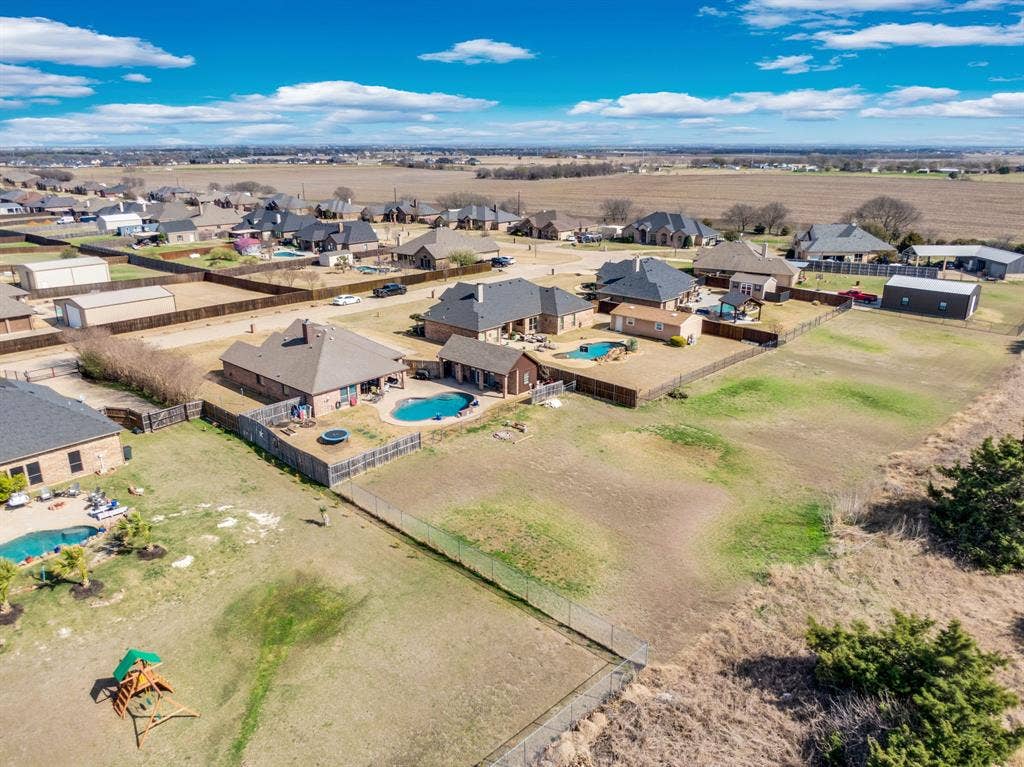 160 Berkshire Lane, Waxahachie, TX 75165 Aerial perspective of suburban area with a pool area