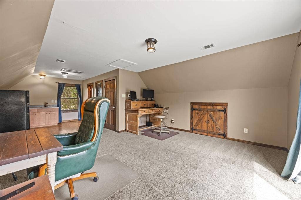 535 Cullins Road E, Rockwall, TX 75032 Apartment above garage features full bath, kitchenette w/sink & refrigerator & stove hookups, as well as a tankless water heater
