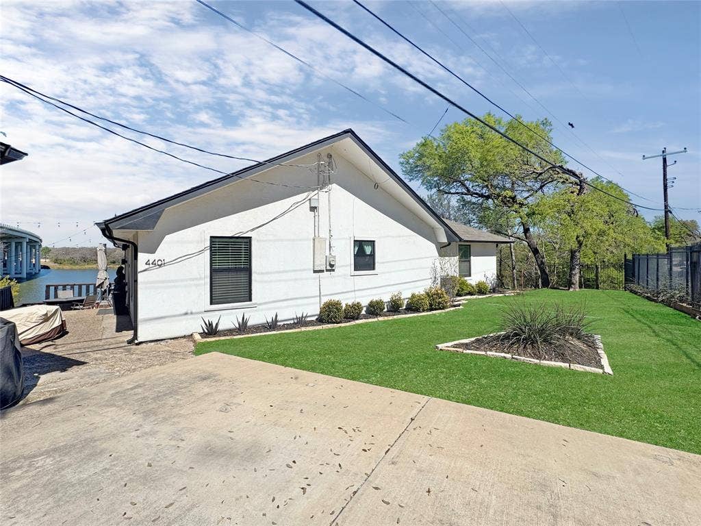 4401 Clarke Drive, Fort Worth, TX 76135 View of side of property with stucco siding