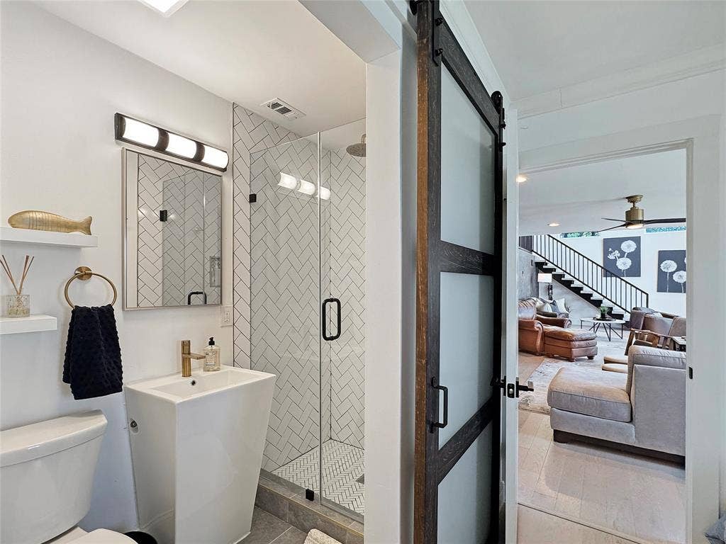 4401 Clarke Drive, Fort Worth, TX 76135 Full bath with a shower stall, a ceiling fan, and vanity on suite