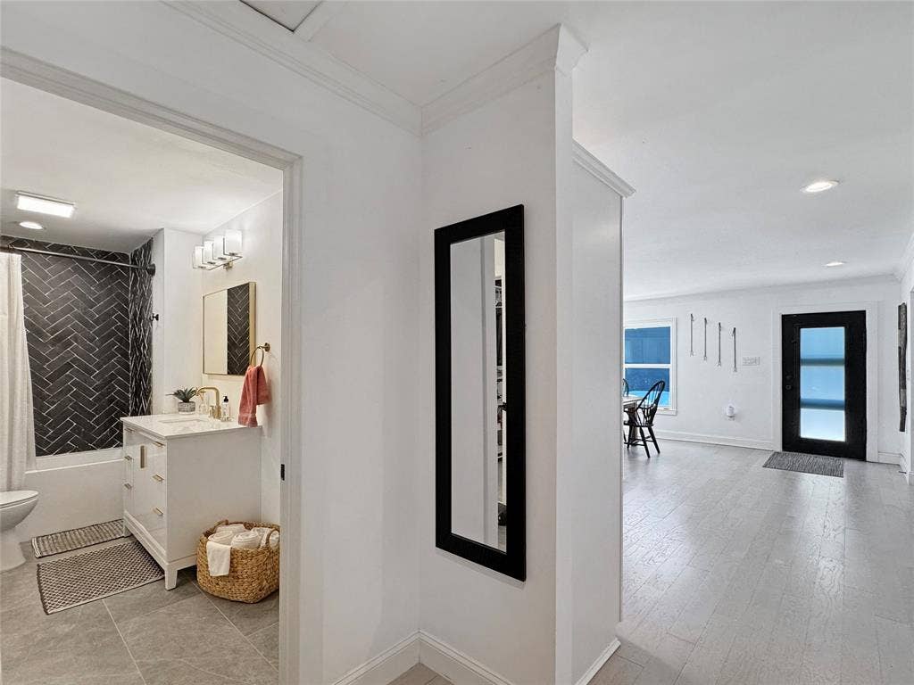 4401 Clarke Drive, Fort Worth, TX 76135 Corridor with recessed lighting and crown molding