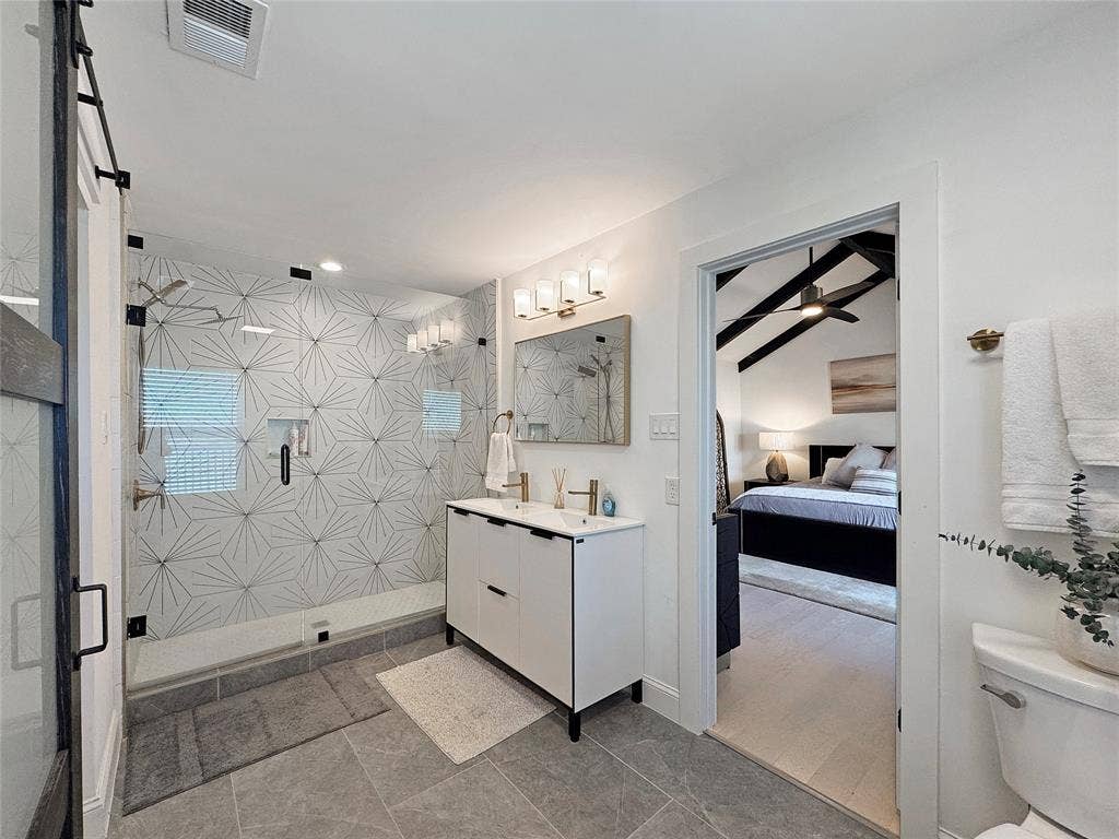 4401 Clarke Drive, Fort Worth, TX 76135 Full bathroom featuring a shower stall, vanity, and ensuite bath