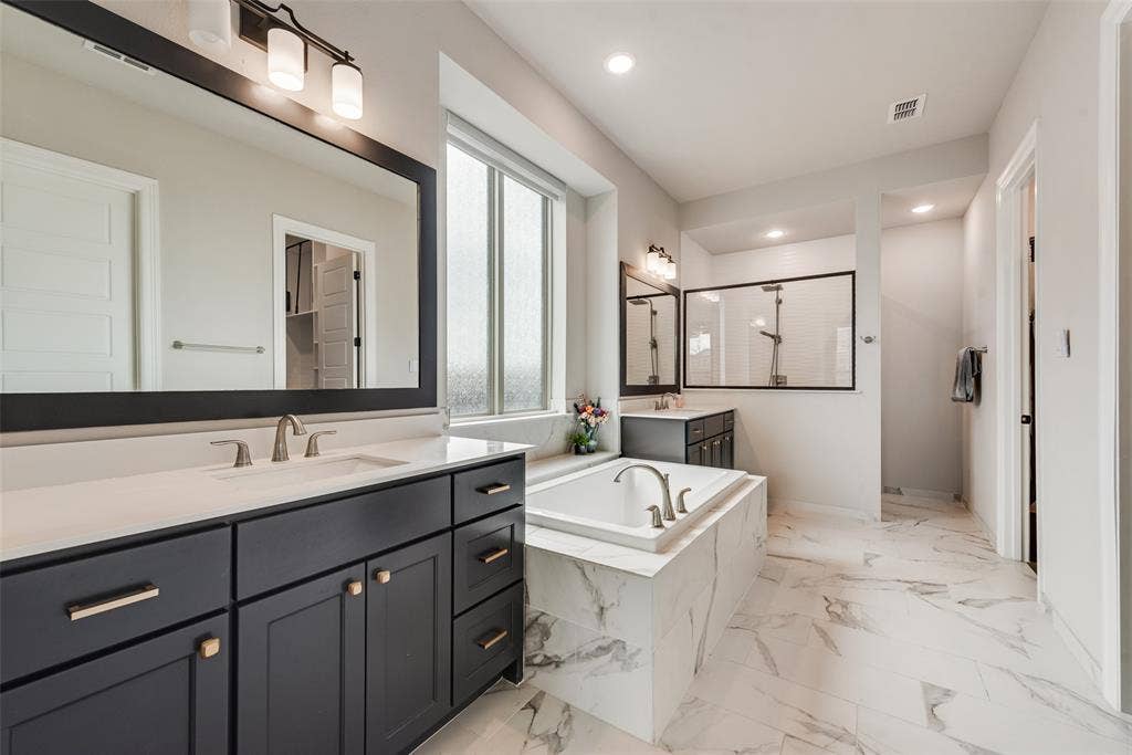 7108 Woodside Drive, Argyle, TX 76226 Luxury bathroom with two vanities, garden tub, luxury shower